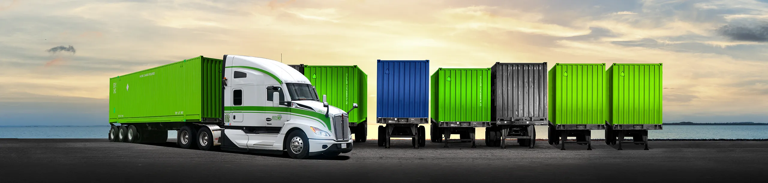 Seven Horses truck flatbed driving with intermodal container in front of parked containers