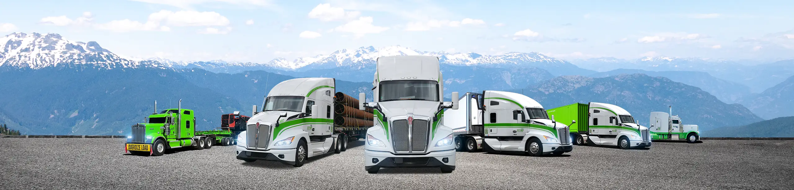 Seven Horses fleet hauling construction equipment, project materials, dry freight, refrigerated goods, container freight parked in front of BC mountains